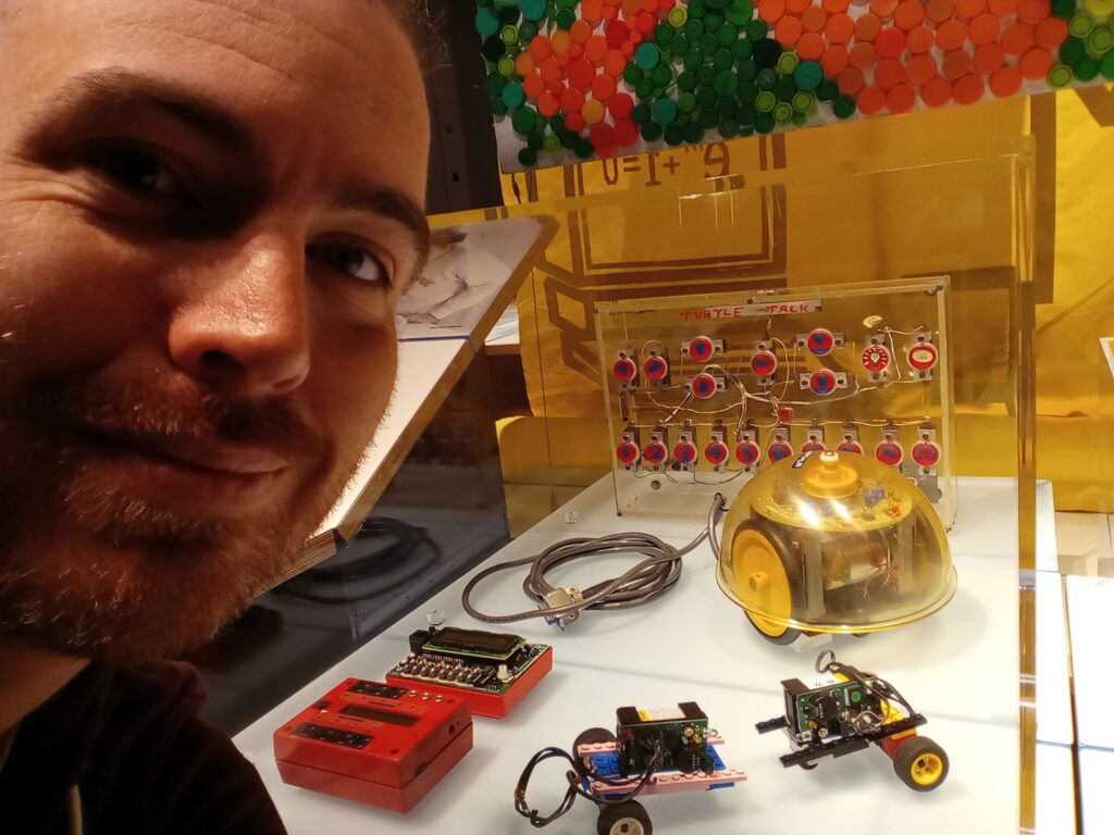 Clinton with Seymour Papert's mechanical turtle at the MIT Museum in Boston.