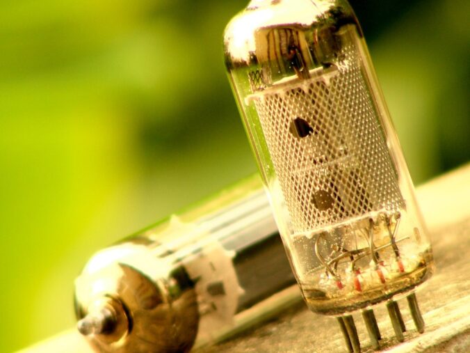 Some vecuum tubes, also known as "electron valves." The grid inside uses a small current sent through a third wire to adjust the flow of a much stronger one between the first two.