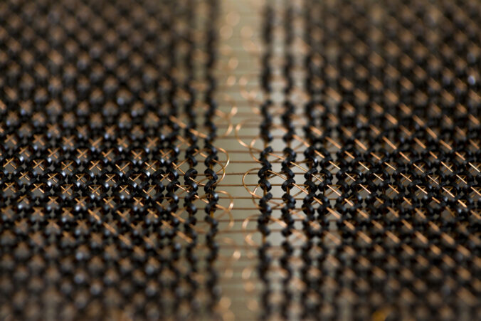 A plane of core memory. In other words, a very, very old RAM module with a magnetic ring to hold one bit.