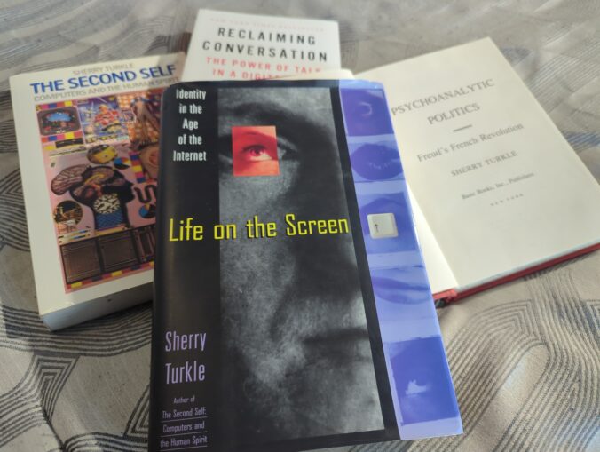 A pile of books by Sherry Turkle. Her 1995 book Life on the Screen lays on top of the rest.